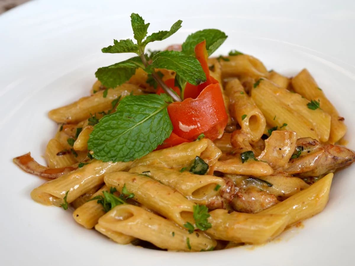 Real close-up food photography of a freshly prepared pasta dish for a restaurant marketing campaign.