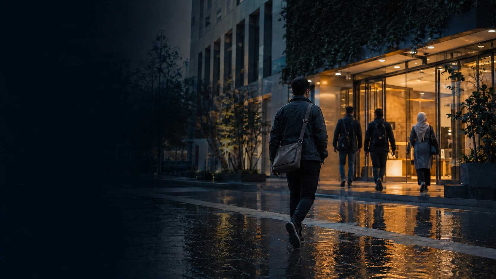 Colleagues entering a warmly lit office on a rainy evening