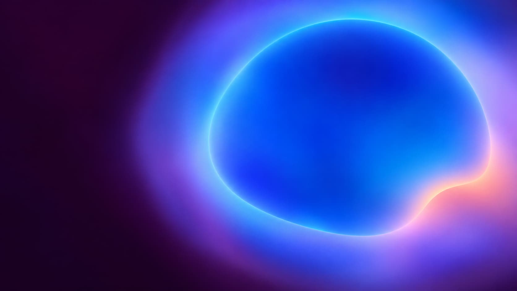 A clearly bounded blue optical region inside a larger diffuse cyan and violet field.