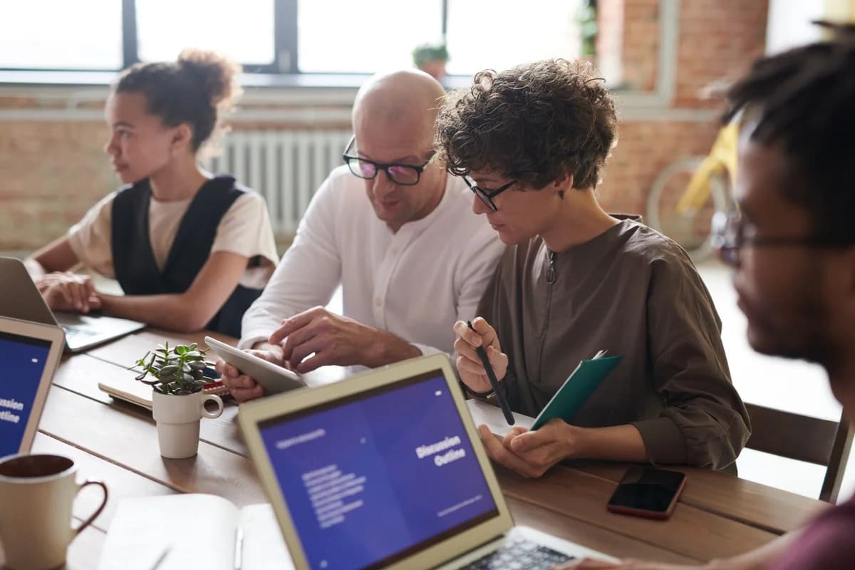Stock photograph of business professionals collaborating in a meeting